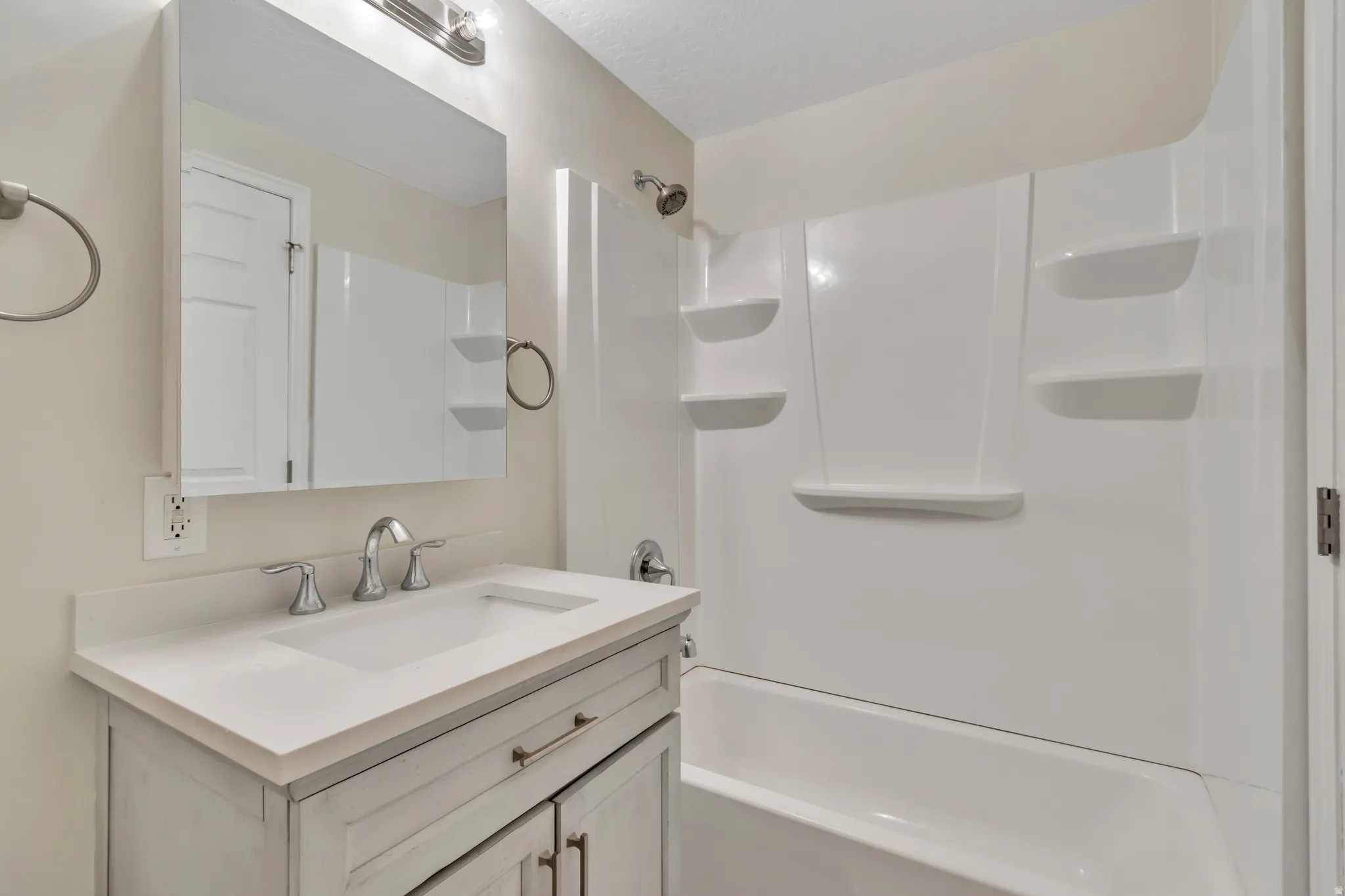 Full bath with vanity and bathtub / shower combination