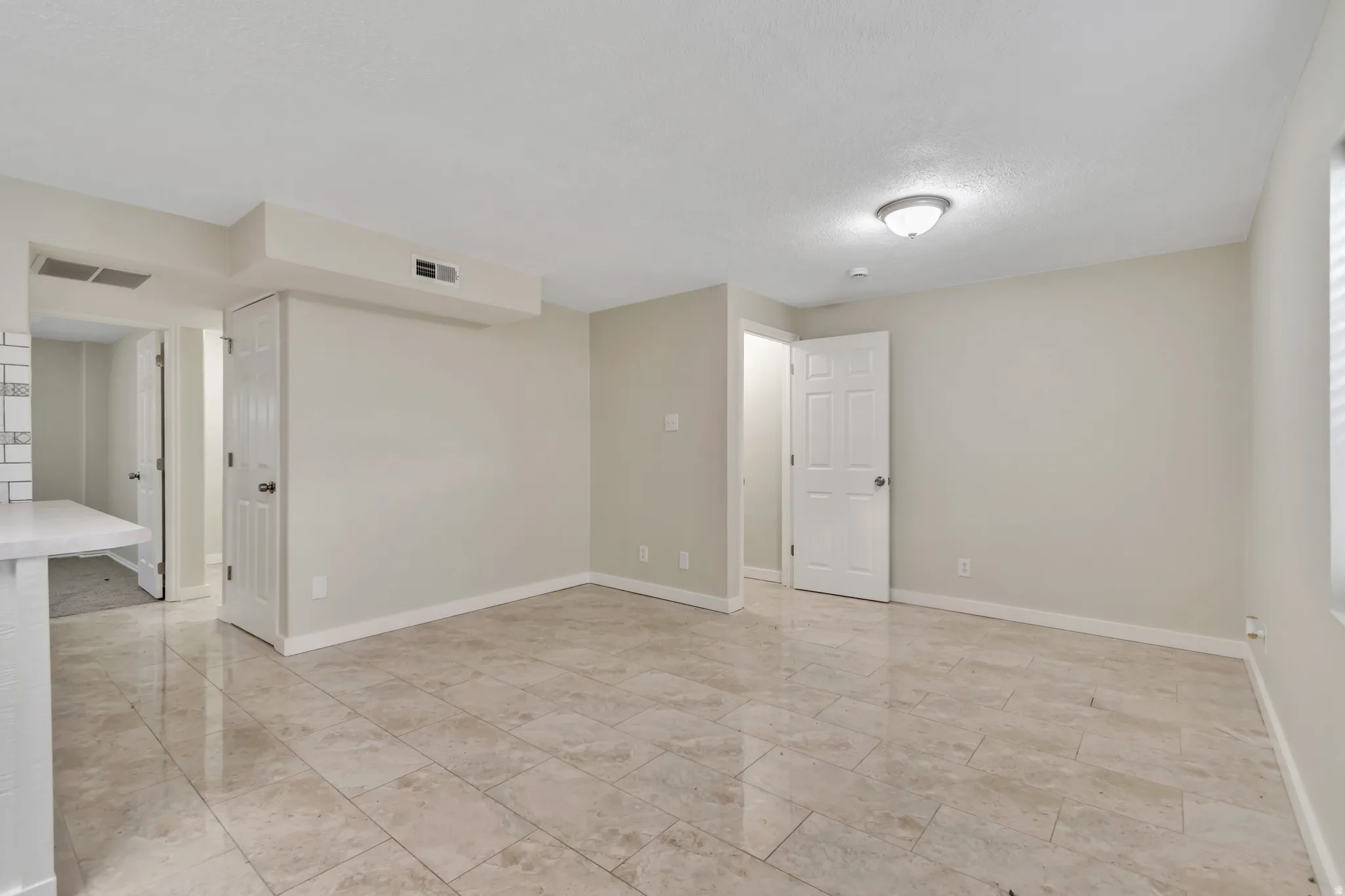 Unfurnished room with baseboards