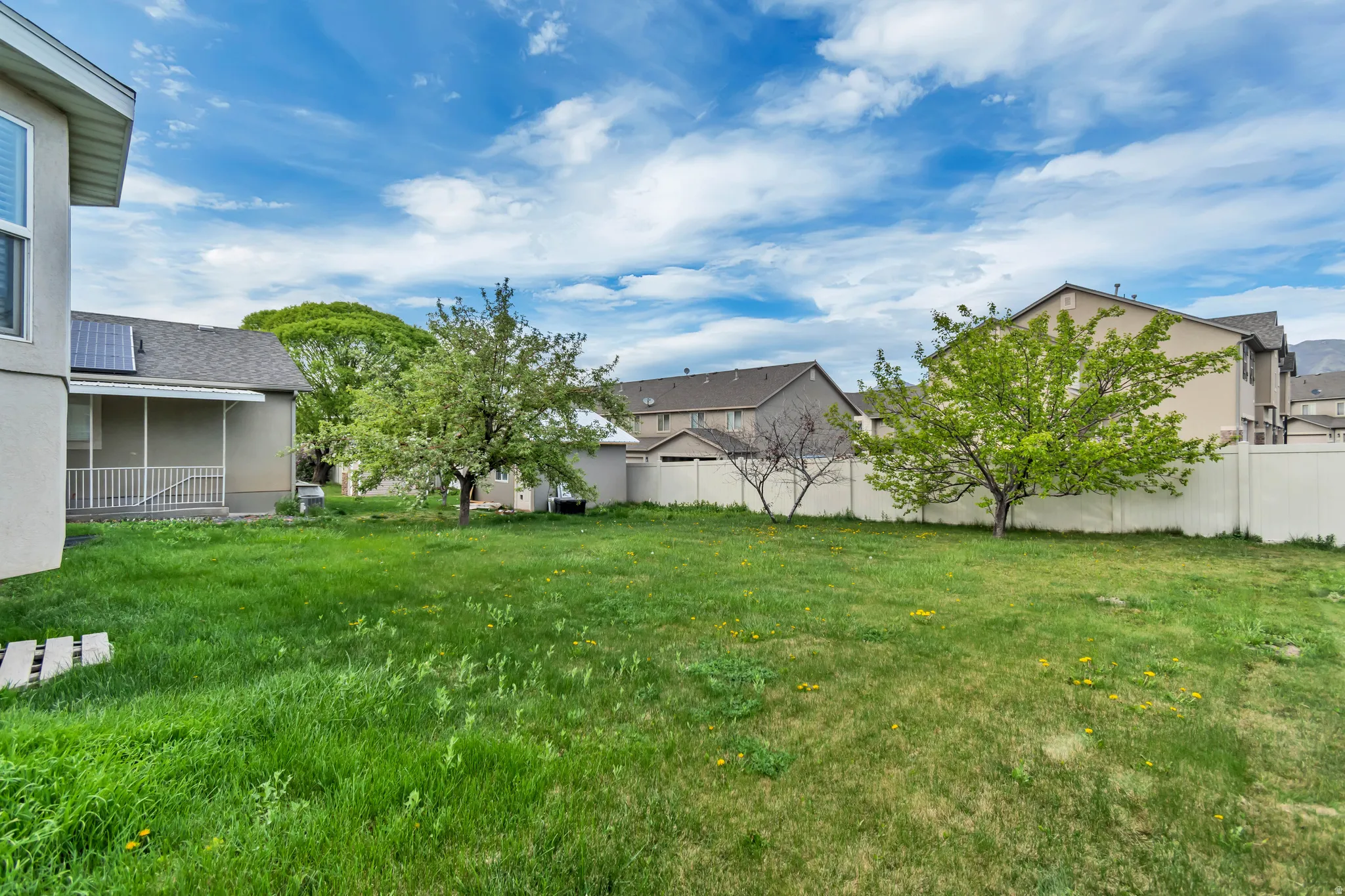 Fenced yard with a residential view