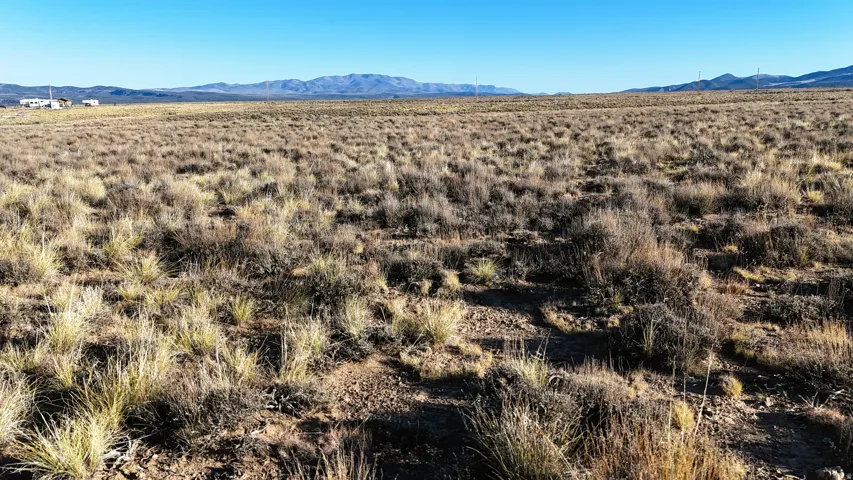 View of mountain background featuring rural landscape