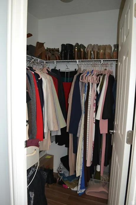 Walk in closet featuring dark wood-style floors