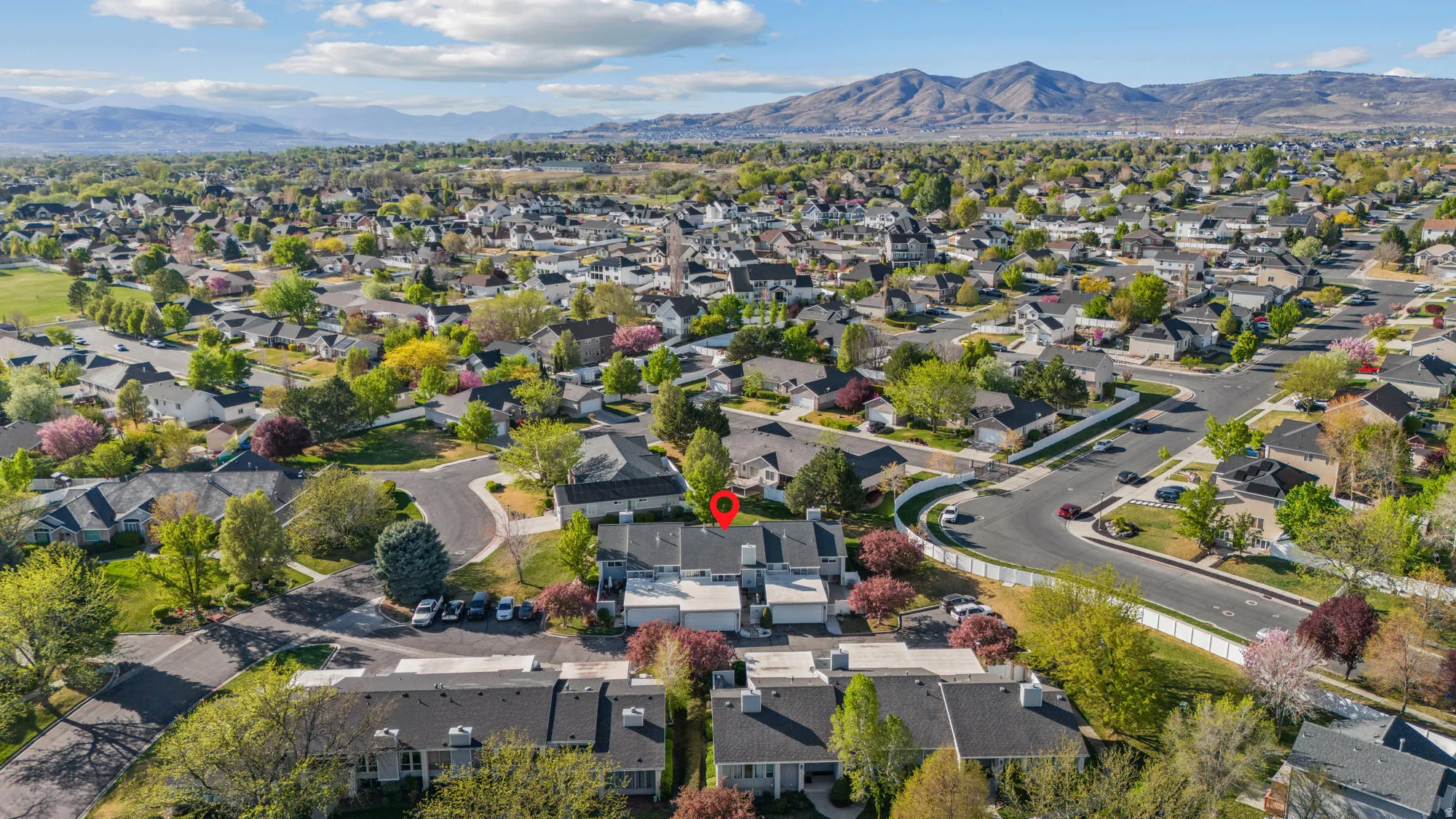 Aerial view of residential area with a mountain backdrop