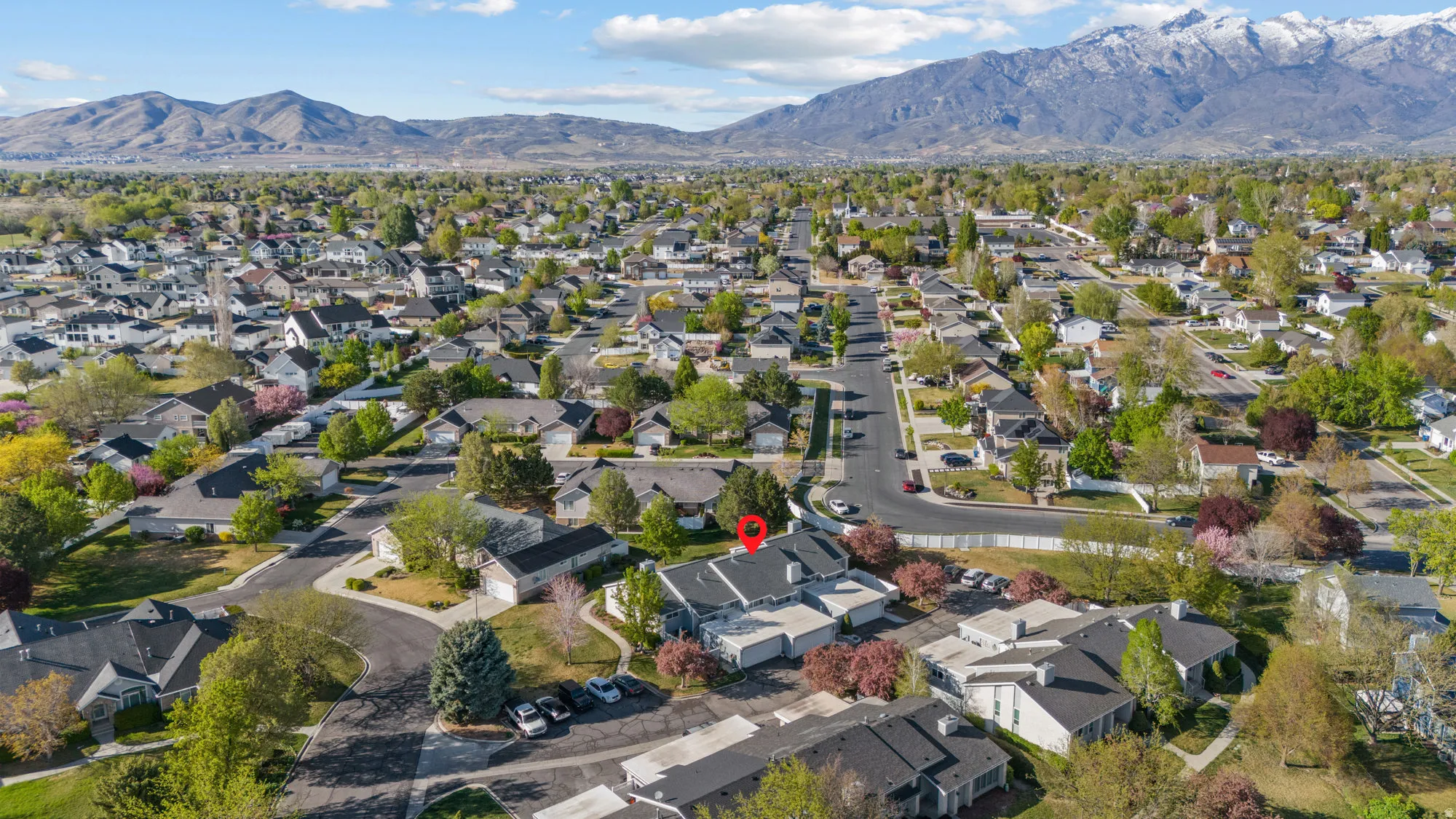 Aerial view of residential area featuring mountains