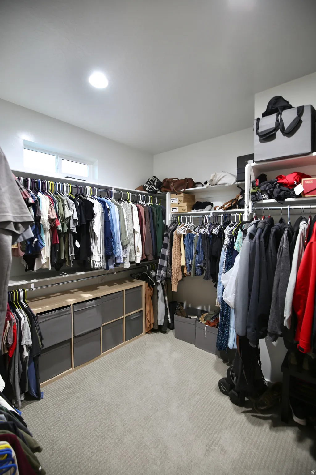 Walk in closet featuring carpet flooring