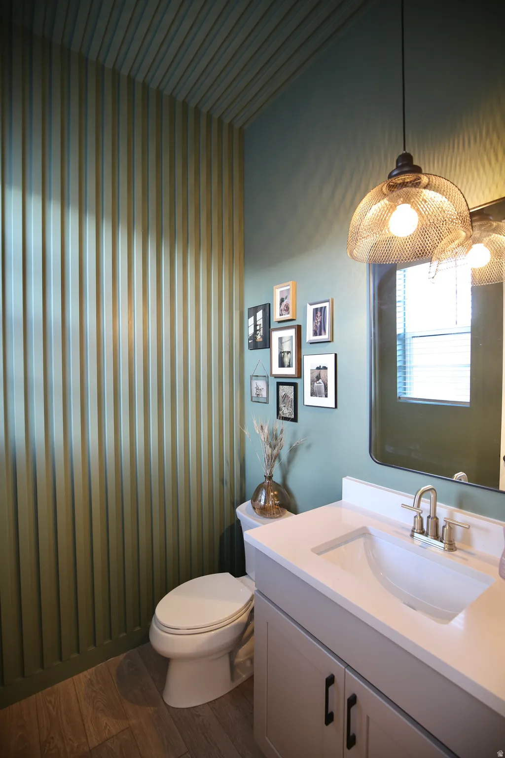 Bathroom with vanity and dark wood-style floors