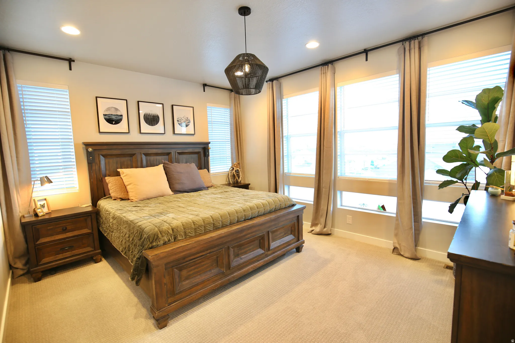 Bedroom with light carpet and recessed lighting