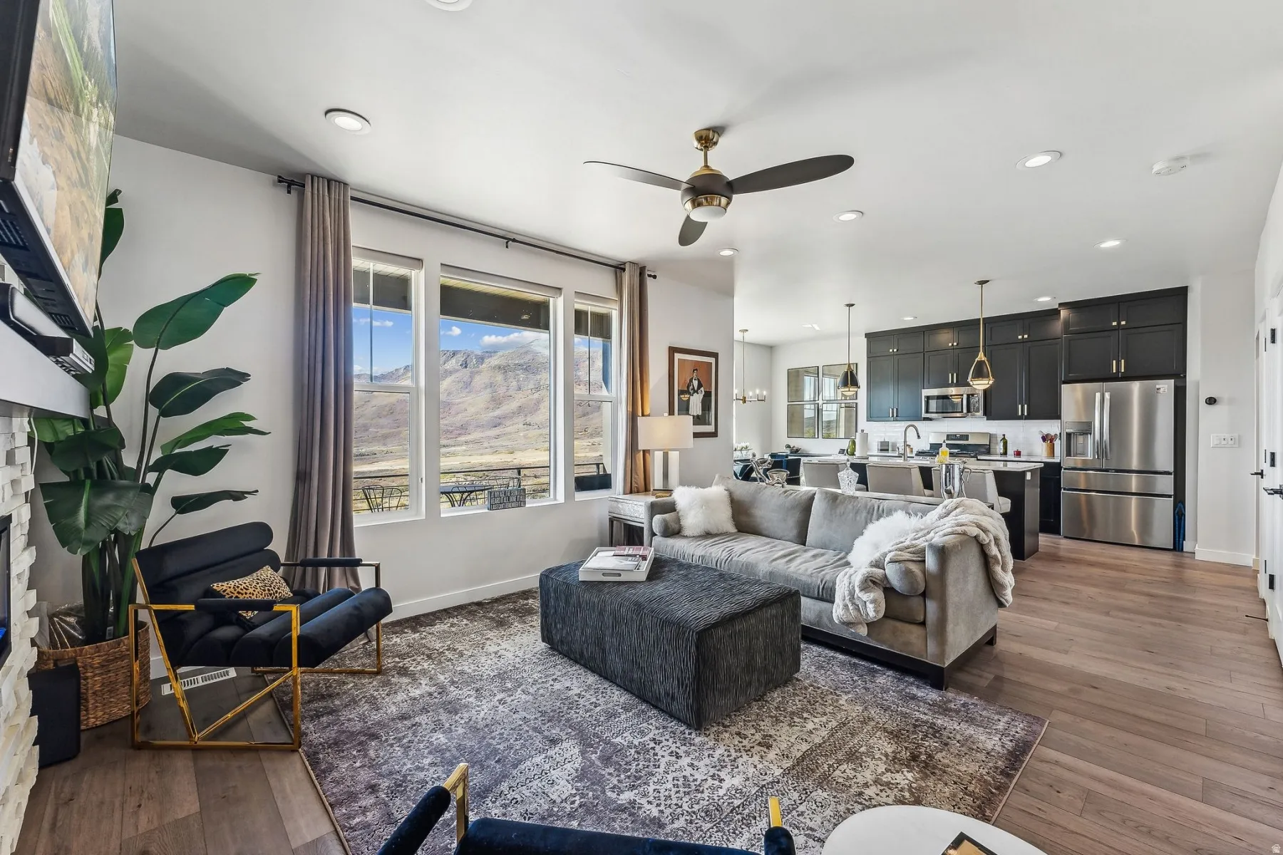 Living area featuring ceiling fan, dark wood-style floors, and recessed lighting
