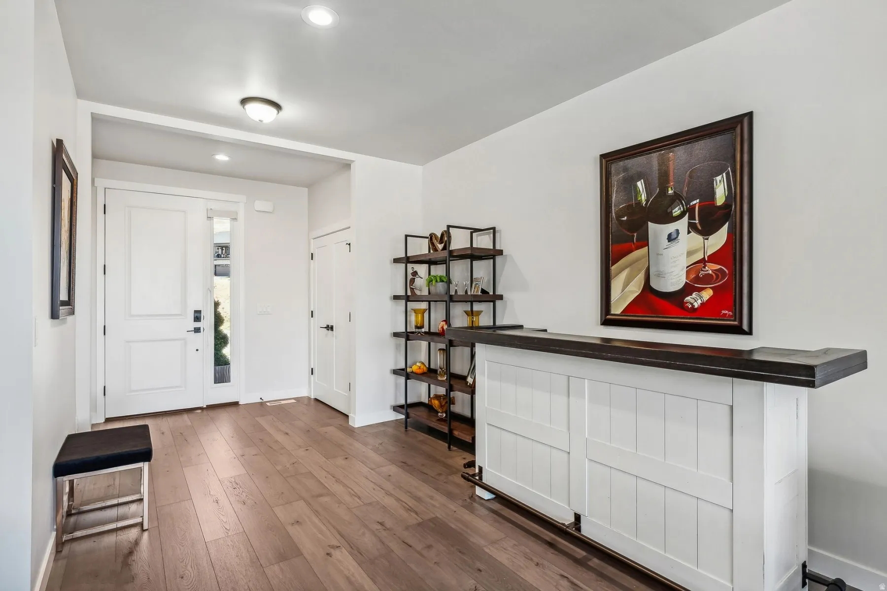 Entryway featuring dark wood-type flooring and recessed lighting