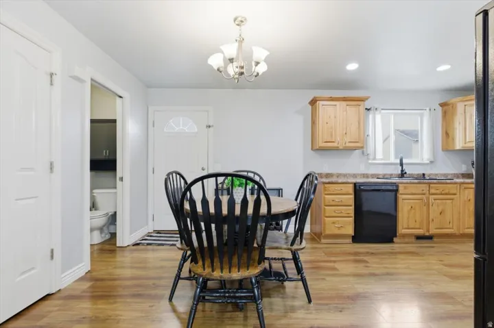 Dining space with a chandelier and light wood finished floors