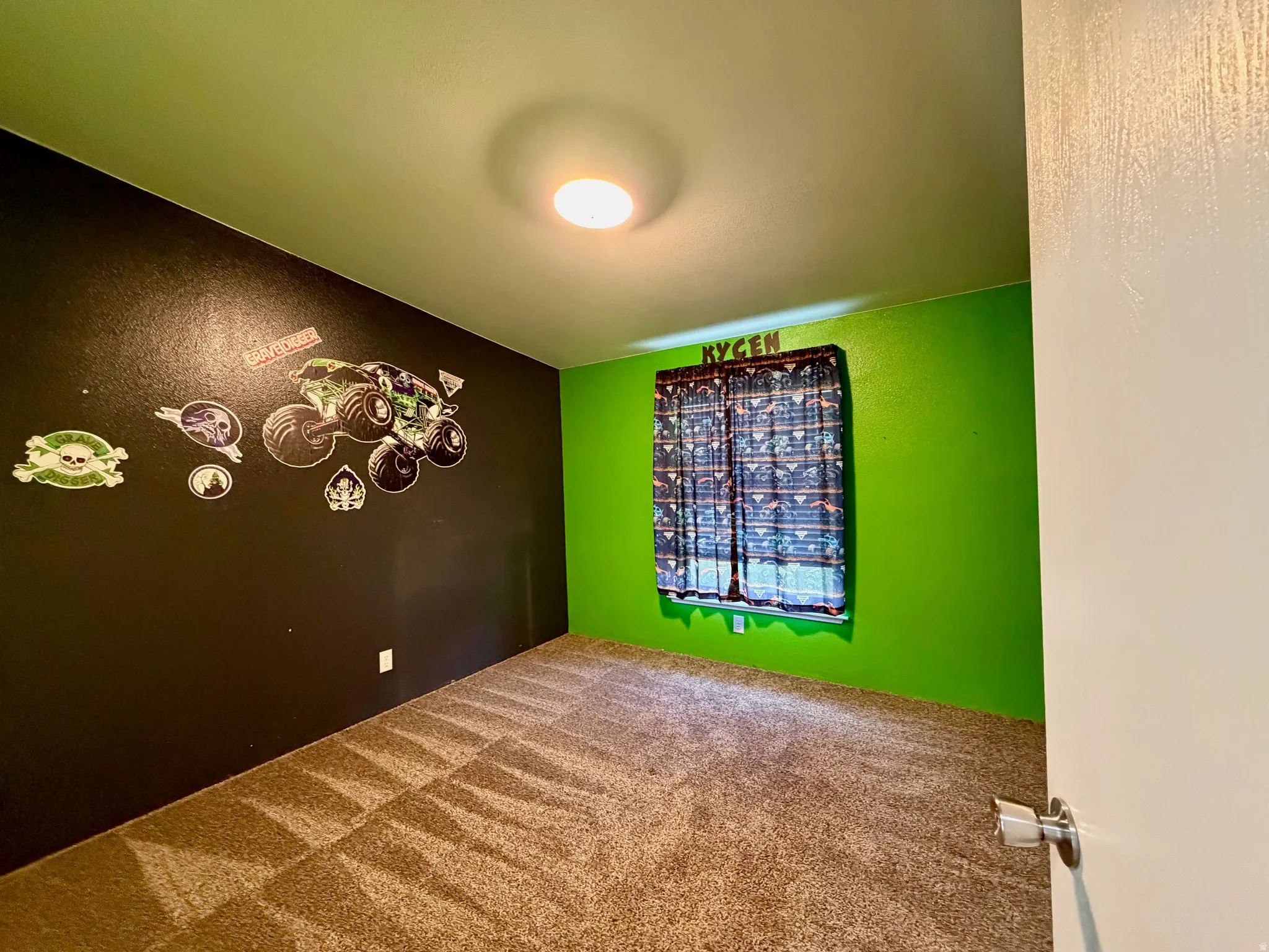 Empty room with carpet and a textured wall