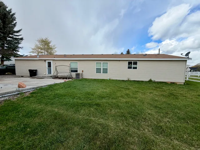 Rear view of property featuring a patio