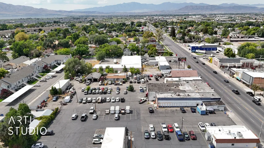 Drone / aerial view of mountains and a commercial area