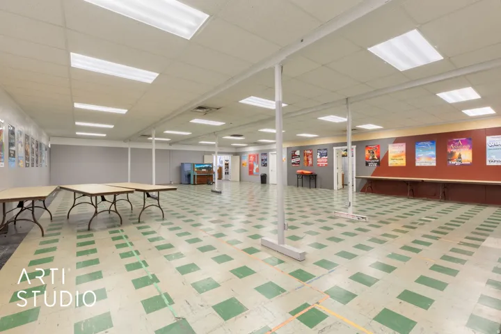Below grade area with light floors and a drop ceiling