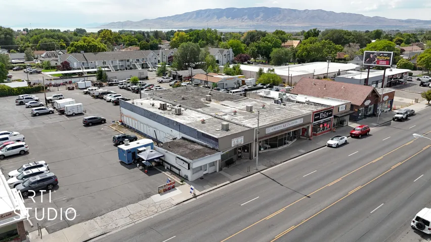 Aerial view of a commercial area and a mountainous background