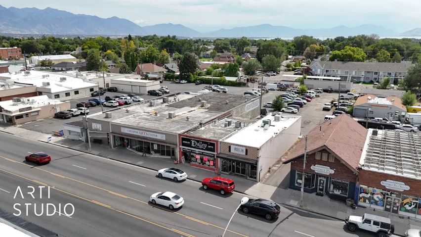 Aerial view of a commercial area and a mountainous background