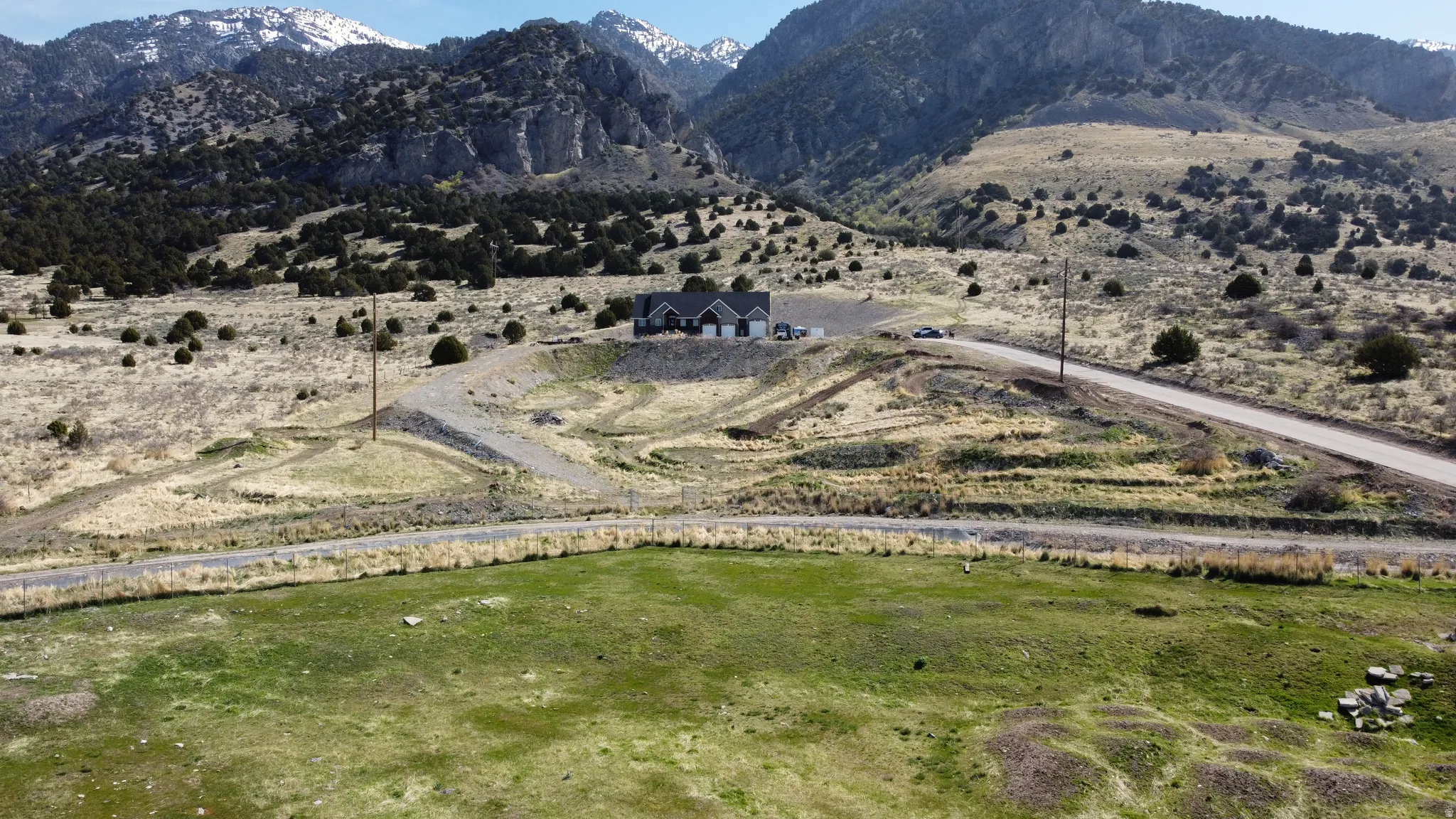 View of mountain background, bike track, and rural landscape
