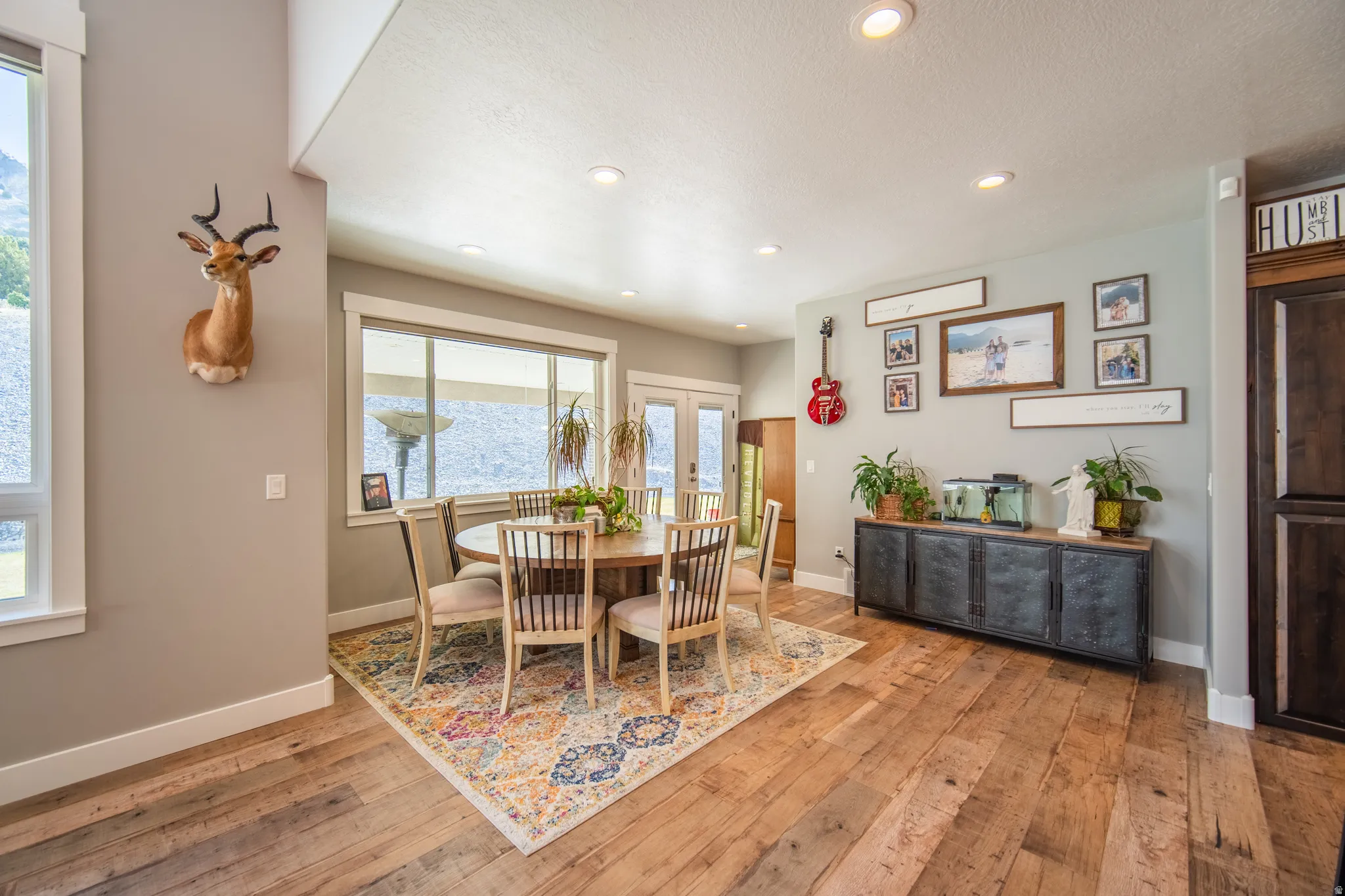 Dining area featuring recessed lighting, wood-style floors, and french doors