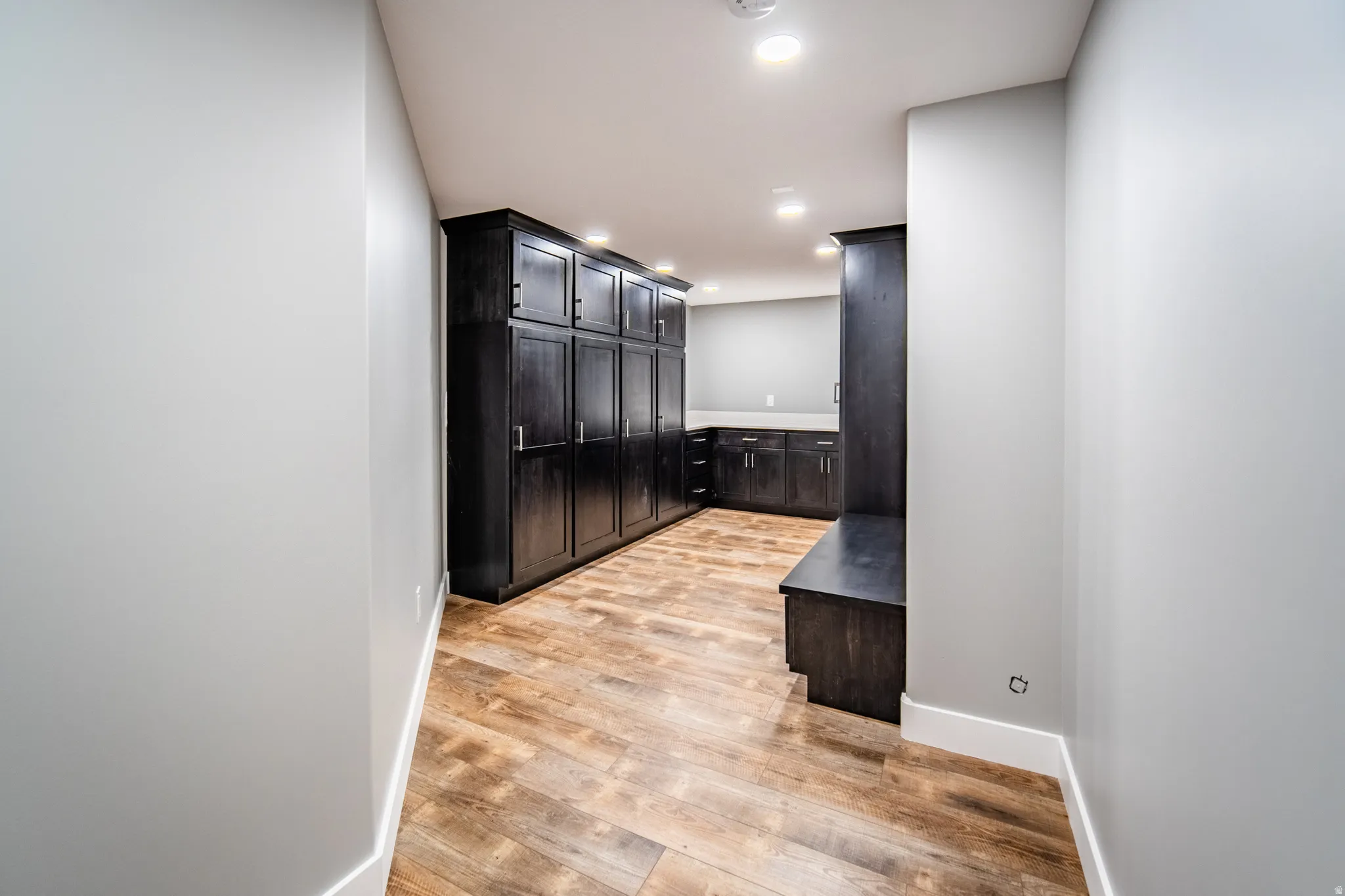 Additional Mud or Gear room featuring wood-style floors, locker style cabinets, and recessed lighting