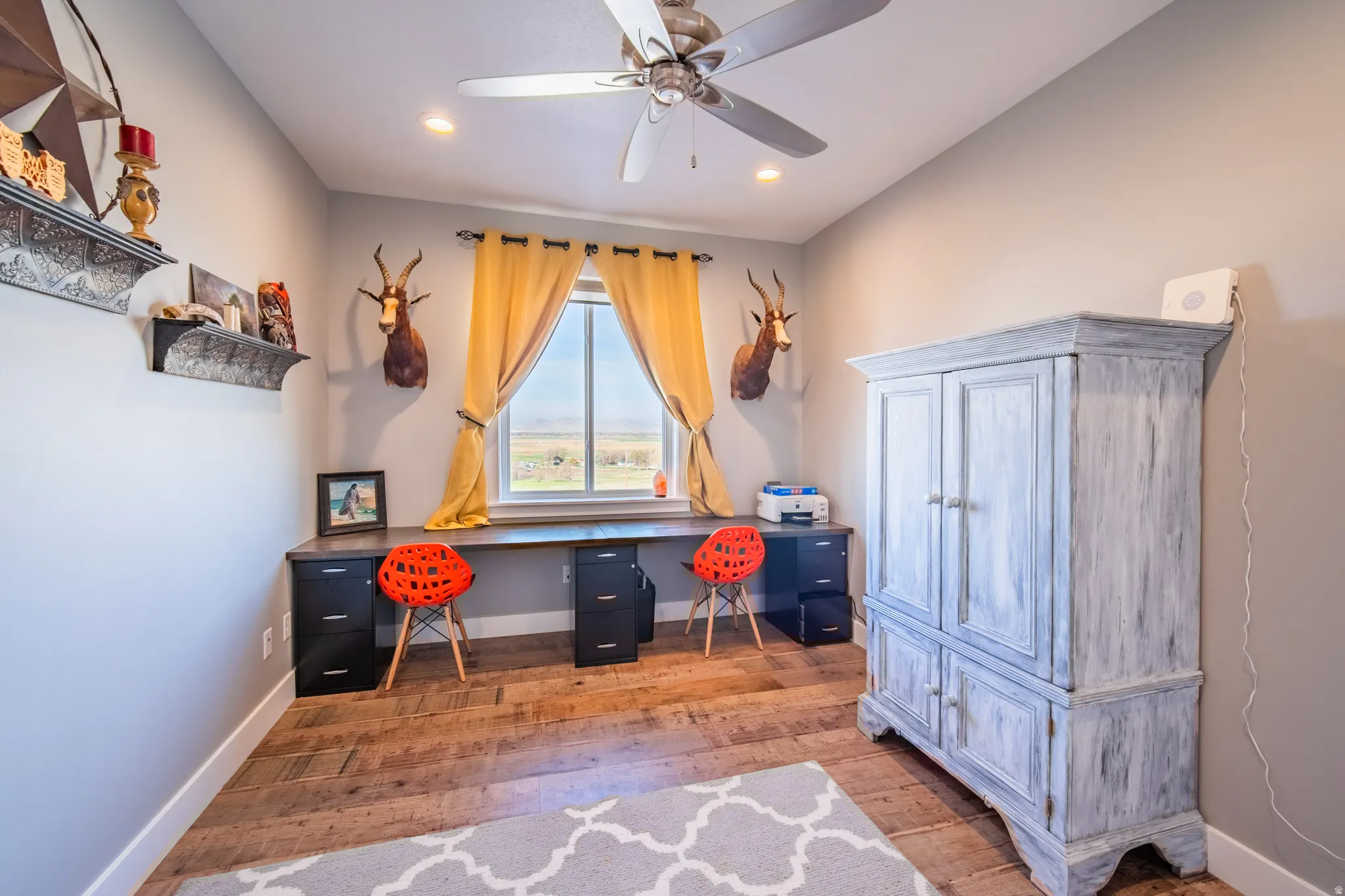 Home office with wood-style flooring, ceiling fan, and recessed lighting