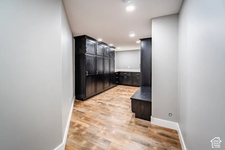 Additional Mud or Gear room featuring wood-style floors, locker style cabinets, and recessed lighting