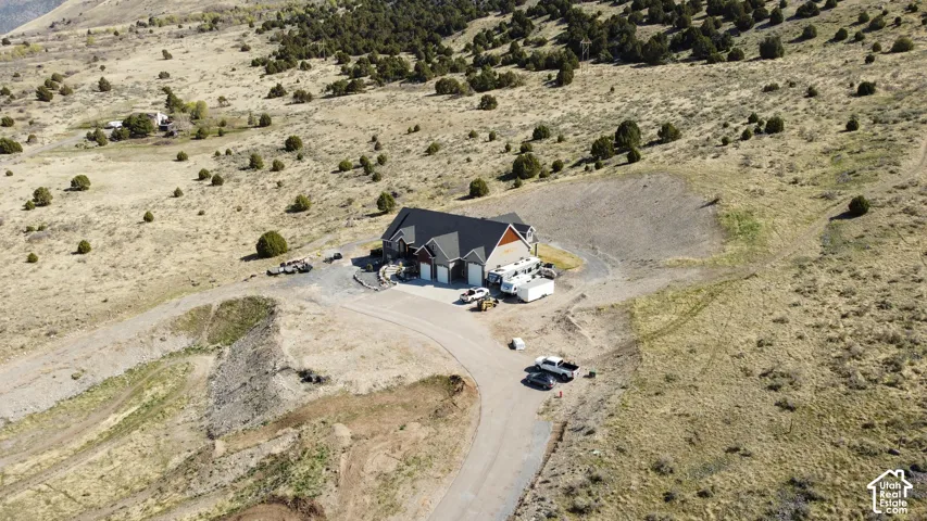Aerial view of property and surrounding area featuring a desert landscape and rural landscape