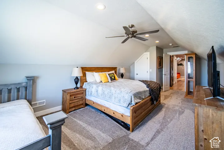 Bedroom with carpet floors, a ceiling fan, and a closet
