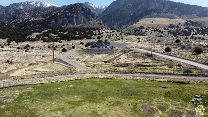 View of mountain background, bike track, and rural landscape