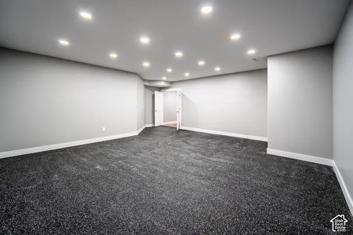 Home gym featuring Interlocking EVA foam flooring and space for equipment and racks.