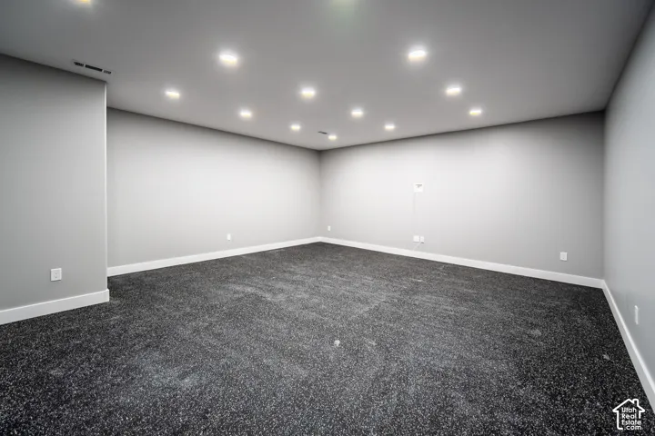 Home gym featuring Interlocking EVA foam flooring, space for equipment and racks, and designated TV location