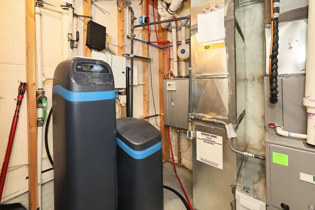Utility room featuring heating unit