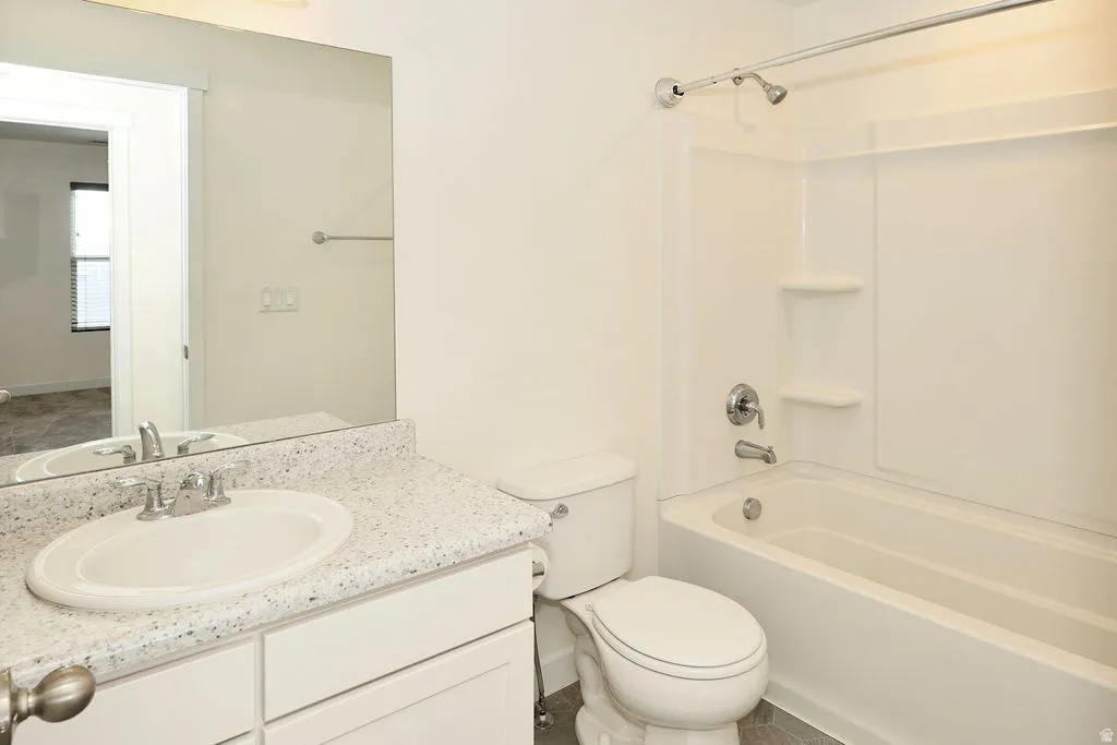 Bathroom with vanity and shower / bathtub combination