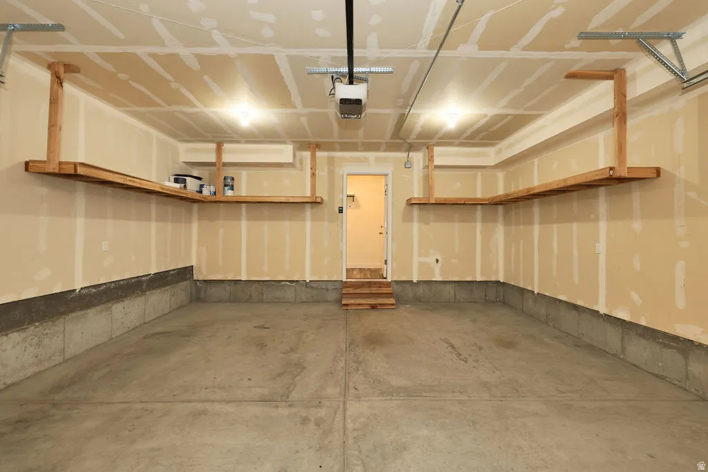 Garage featuring a garage door opener