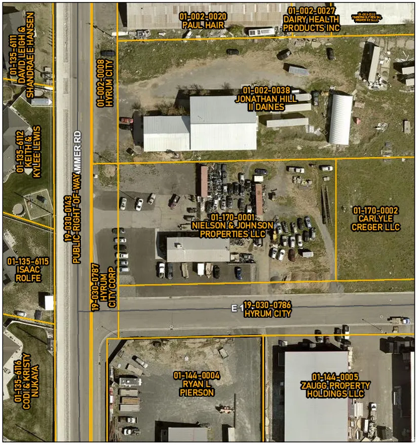 Aerial map of property and surrounding area featuring property boundaries highlighted