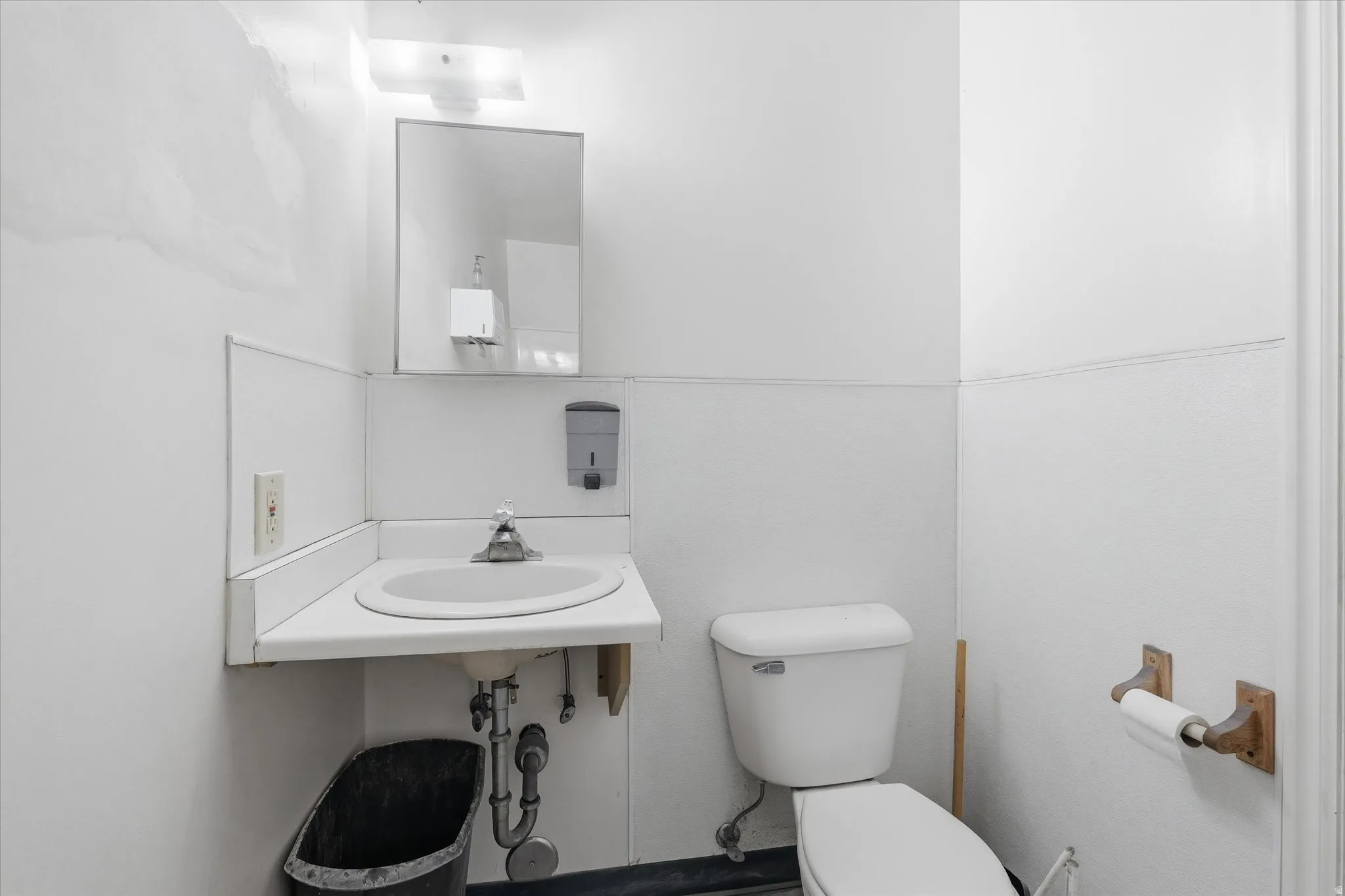 Bathroom featuring toilet and a sink