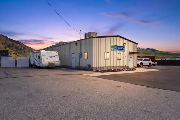 Property at dusk with a mountain view