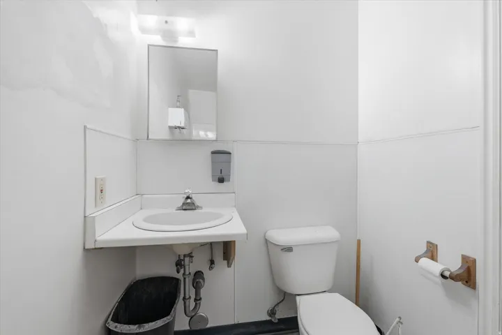 Bathroom featuring toilet and a sink