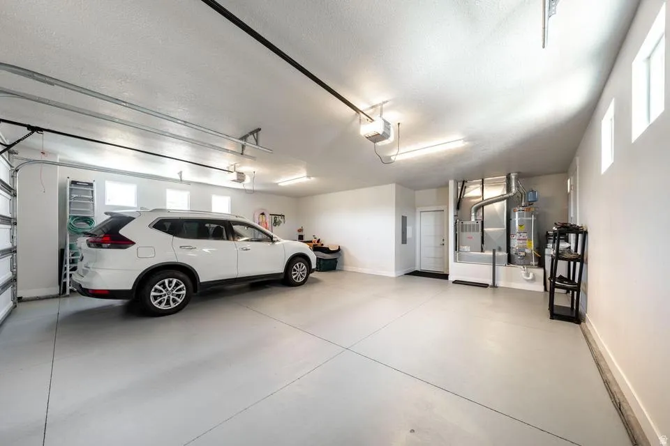 Garage with water heater and heating unit