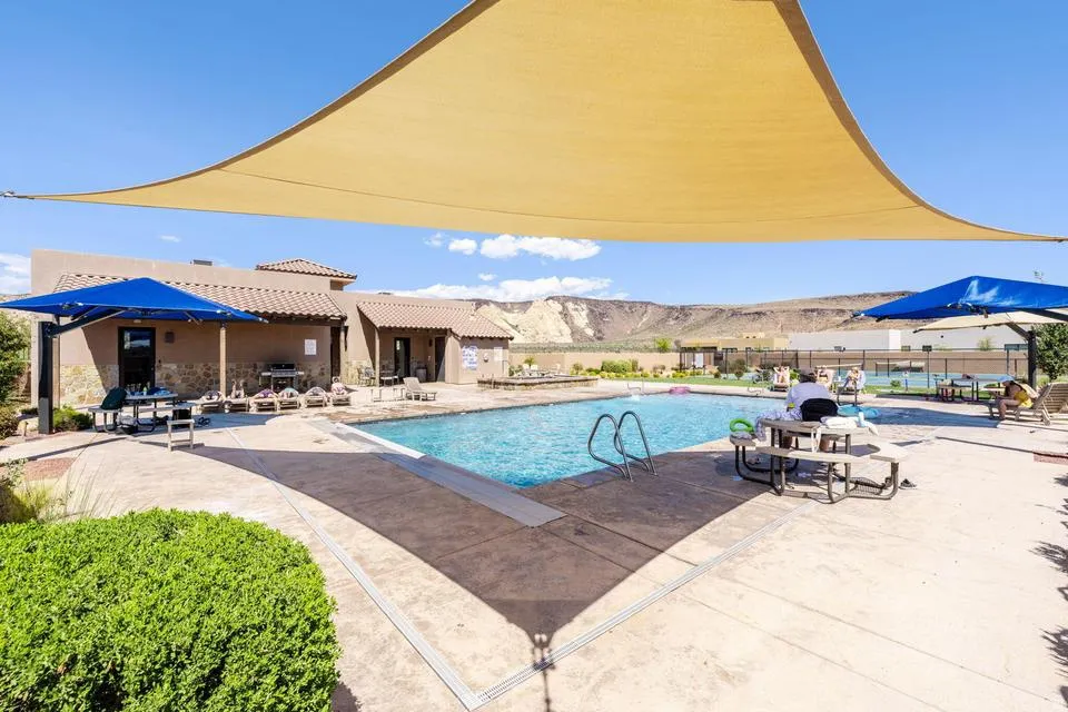 Community pool with a patio and a mountain view