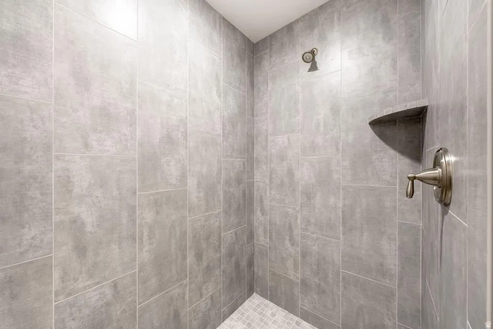 Full bathroom with tiled shower