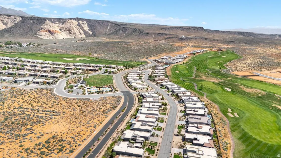 View of property location with a mountain backdrop and nearby suburban area