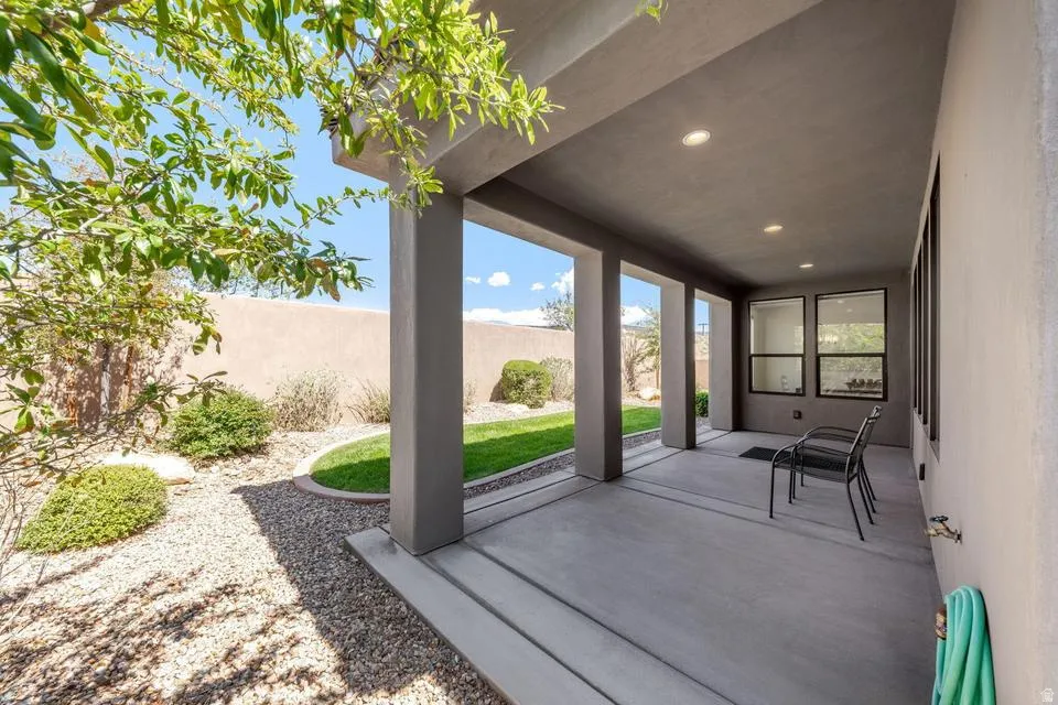 Fenced backyard with a patio area