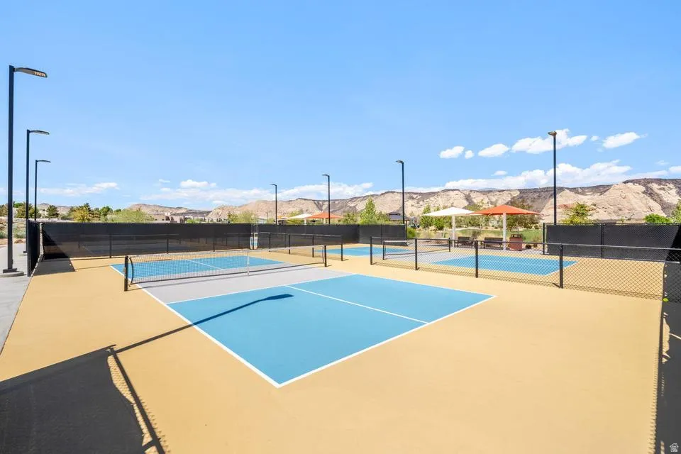 View of tennis court featuring a mountain view