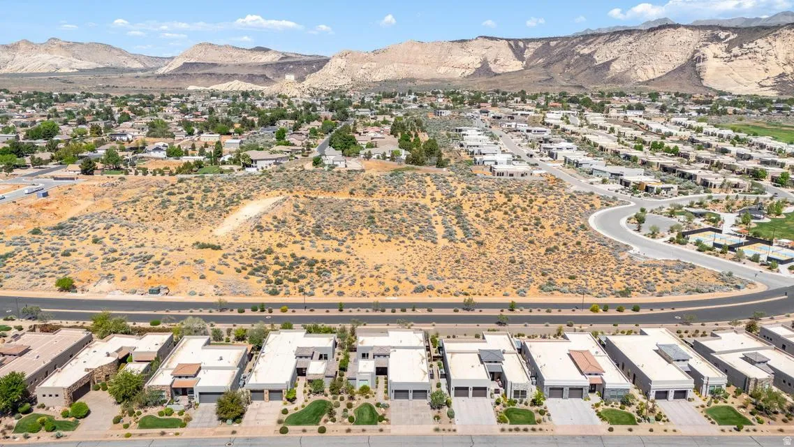 Aerial perspective of suburban area with a mountainous background