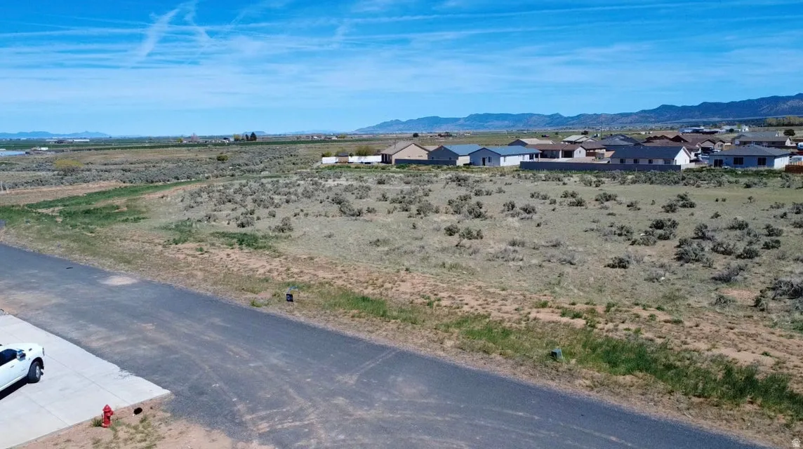 View of mountain backdrop featuring nearby suburban area