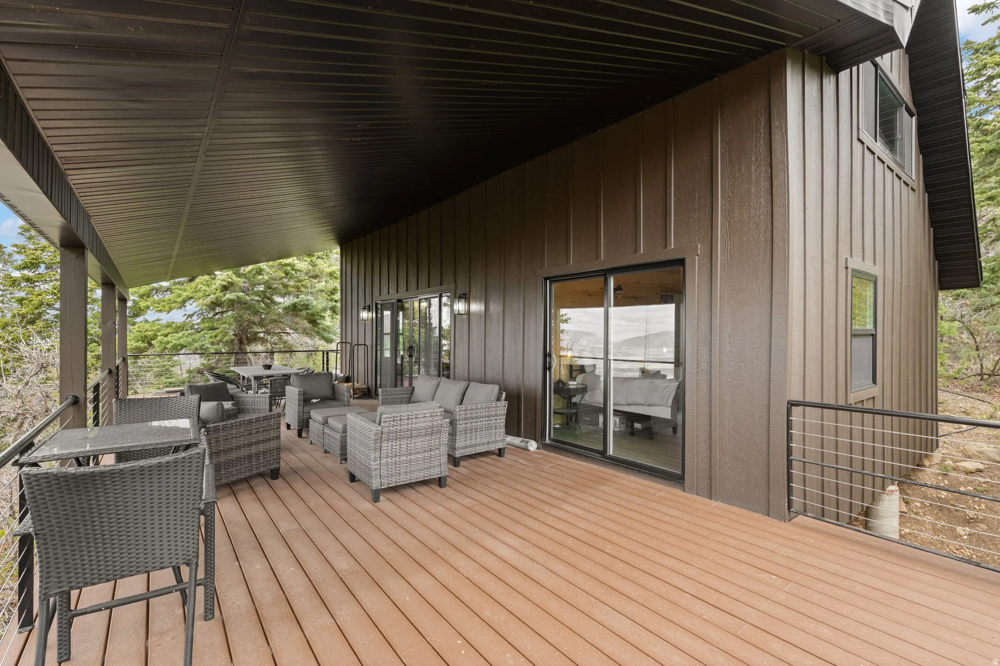 Cabin 1 - West; Deck featuring an outdoor living / dining area