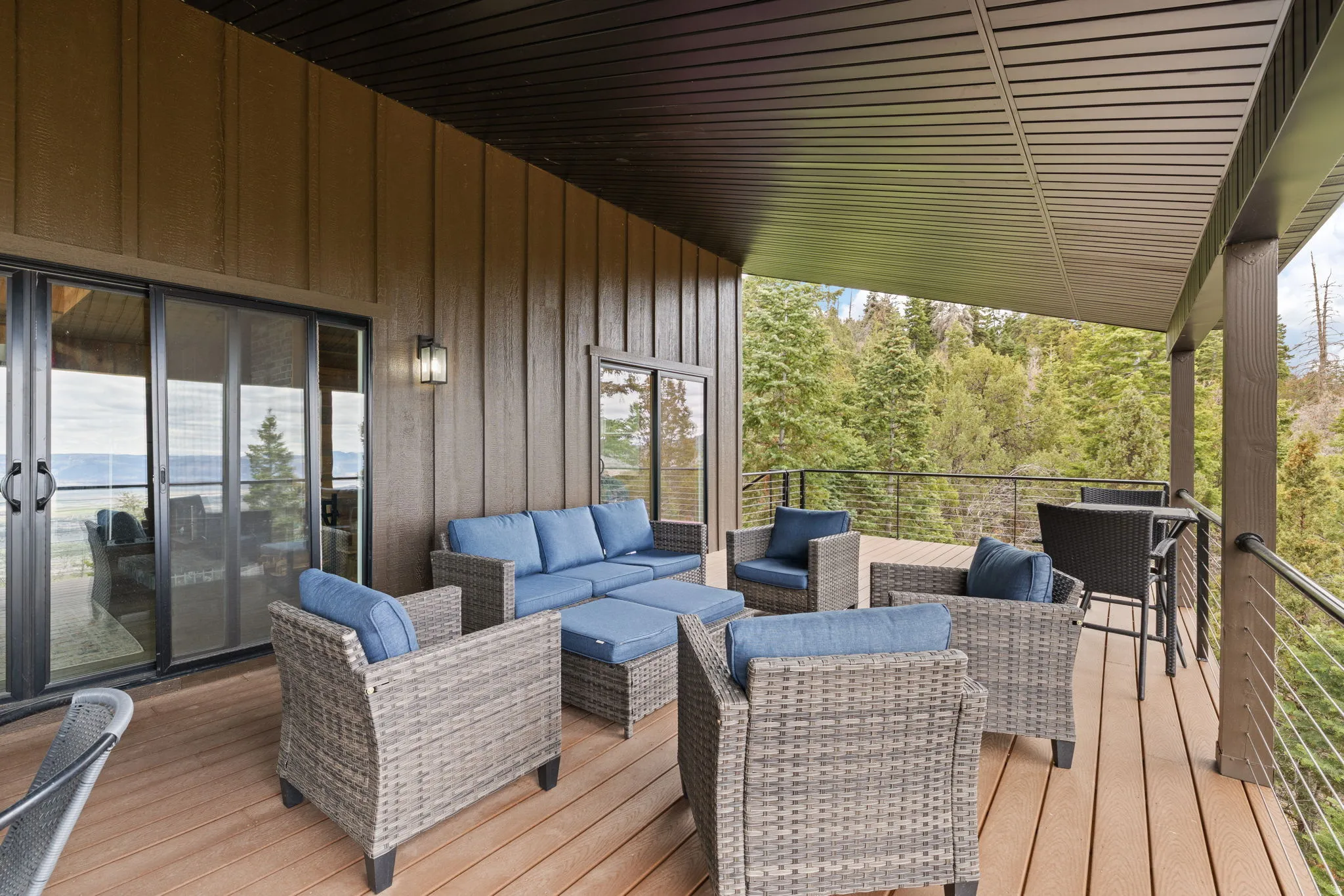 Cabin 1 - West; Wooden terrace featuring an outdoor living space