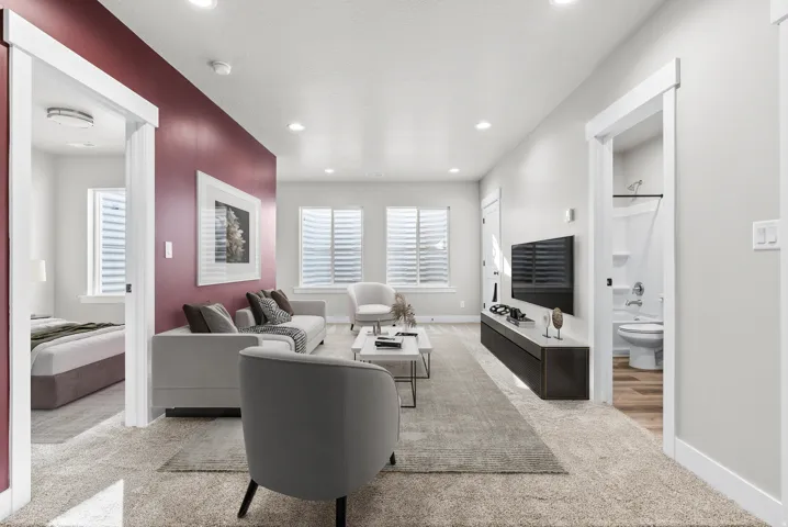 Living room featuring light colored carpet and recessed lighting