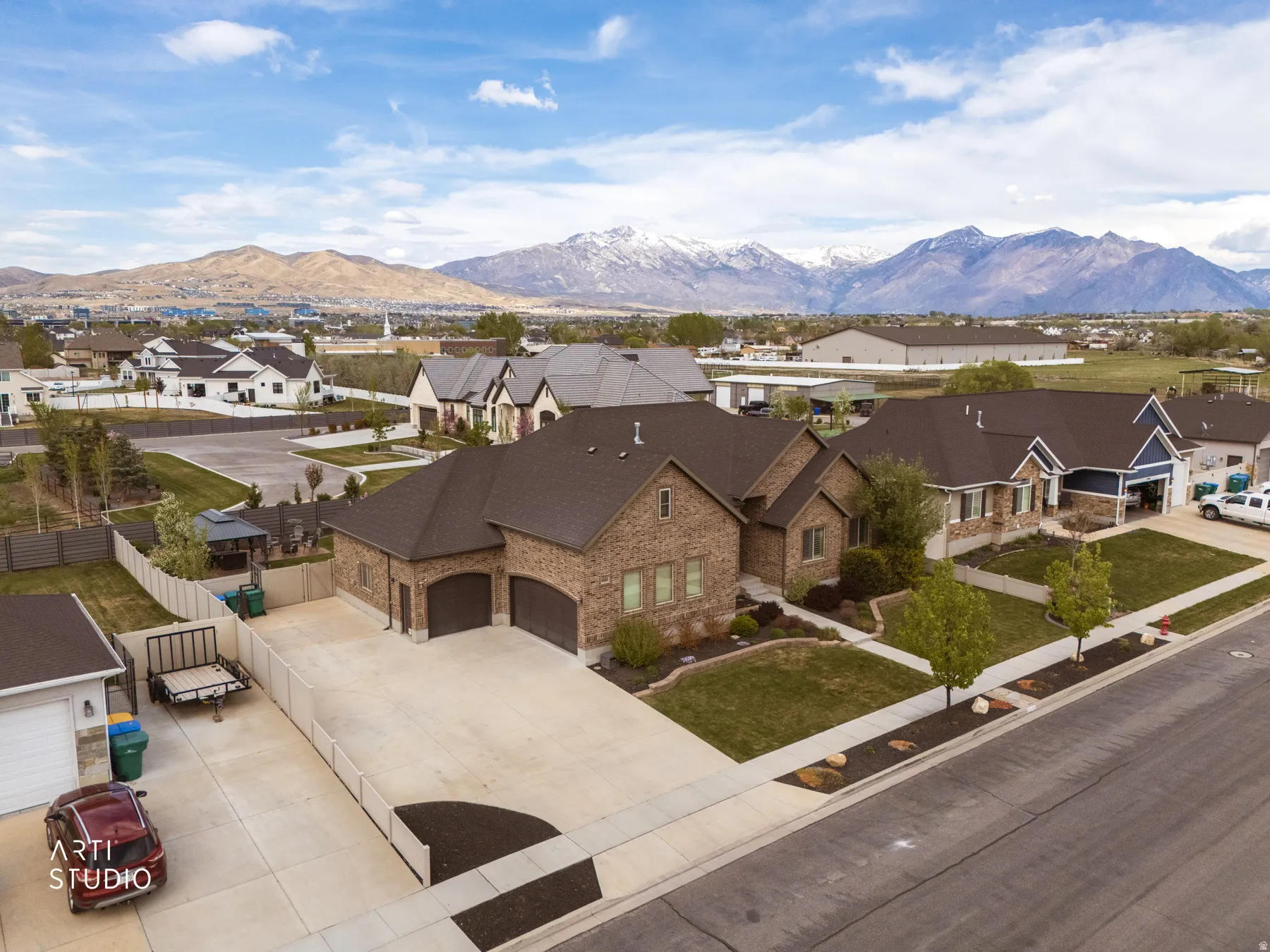 Aerial view of residential area featuring a mountain backdrop