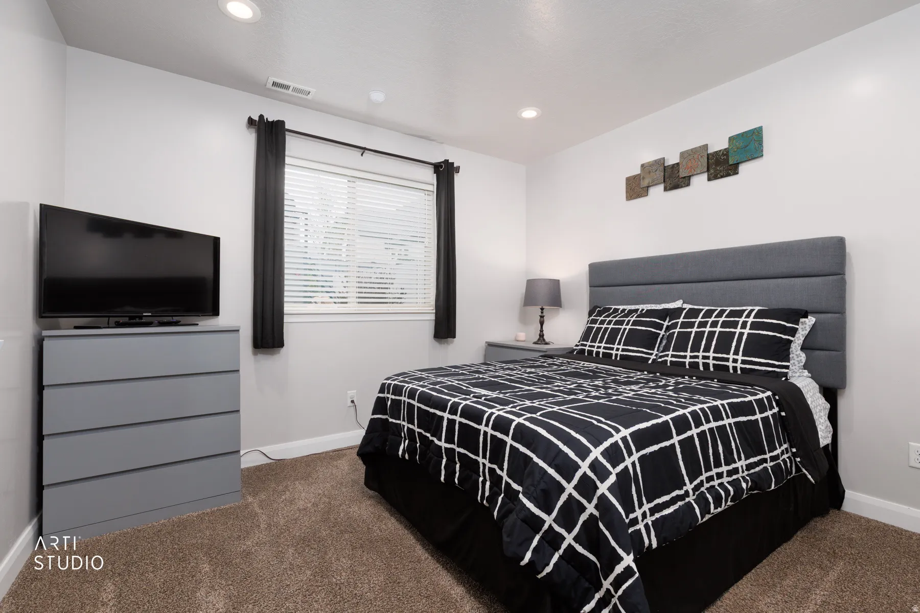 Bedroom featuring dark carpet and recessed lighting