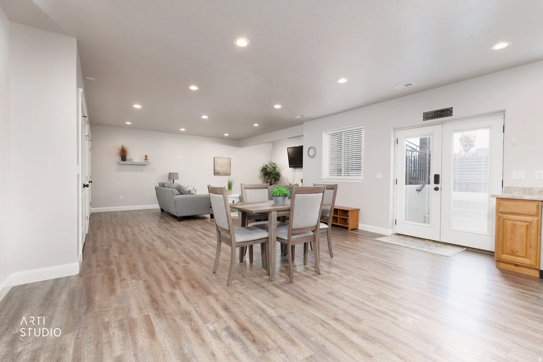 Dining space featuring french doors, recessed lighting, and light wood-type flooring